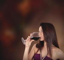 Girl drinking wine photo