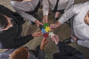 Teamwork of partners. Concept of integration and startup with puzzle pieces. photo