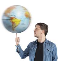 Boy turns the globe photo