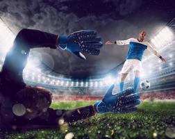 Goalkeeper catches the ball in the stadium during a football game. photo