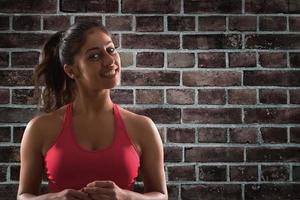 Smiling woman at the gym ready to start fitness lesson photo