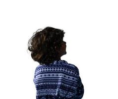 Child from behind in dressing gown looking away photo