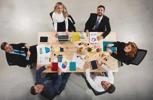 Team of businessmen work together in office. Concept of teamwork and partnership photo