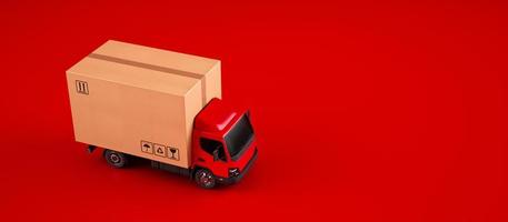 Big cardboard box package on a red truck ready to be delivered photo