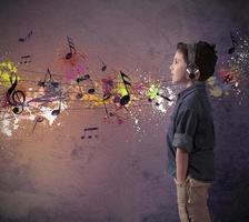 Young boy listening to music photo