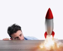 Startup of a new company with starting rocket. Concept of new business photo