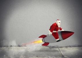 Fast delivery of Christmas gifts ready to fly with a rocket photo