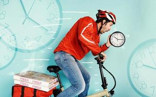 Deliveryman runs fast with electric bike to deliver pizza and avoid delay photo