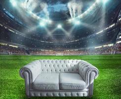 White sofa at the center of the soccer field photo
