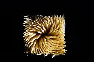 Top view of Spiral Toothpicks in black background. Macro shot of Toothpicks. Close up. Isolated photo