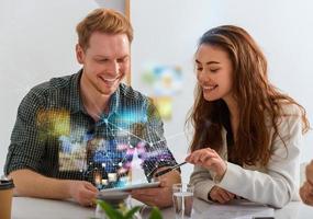 Businessman works in office with a tablet connected on internet photo