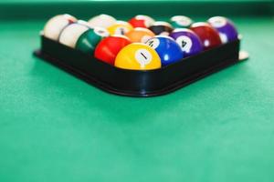 balls on a billiard table in a triangle. game of American billiards photo