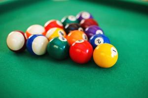 balls on a billiard table in a triangle. game of American billiards photo