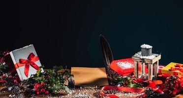 Desk with presents and a blank letter to santa claus photo