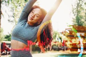 Woman does gym stretching exercises outdoor in a sunny day photo