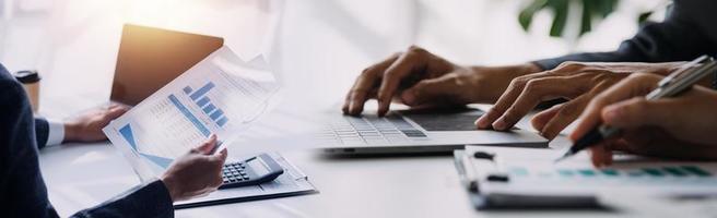 Team Of Business working at office with documents on his desk, doing planning analyzing the financial report, business plan investment, finance analysis concept photo