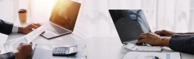 Team Of Business working at office with documents on his desk, doing planning analyzing the financial report, business plan investment, finance analysis concept photo