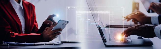 Project manager working with Gantt chart schedule to plan tasks and deliverables. Scheduling activities with a planning software, Corporate strategy for finance, operations, sales, marketing. photo