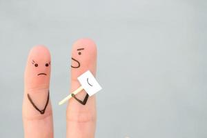 Fingers art of family during quarrel. Concept of people hiding emotions. Husband shouts on wife. Space for text. photo