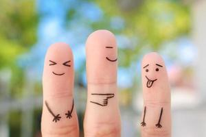 Fingers art of happy family. Concept of child makes face and parents laugh. photo