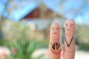 Fingers art of happy couple. Concept of woman proposing to man. photo