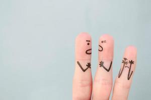 Fingers art of family during quarrel. Concept of parents quarrel, child was upset. photo