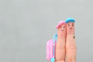 Fingers art of happy couple. Man and woman going on vacation. photo