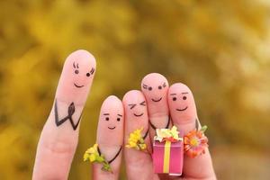 Fingers art of happy people. Concept schoolchildren give flowers to the teacher. Mother's Day. Knowledge Day. September 1. Teacher's Day. photo