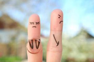 Fingers art of couple. Concept woman made an offer to get married, man refused. photo