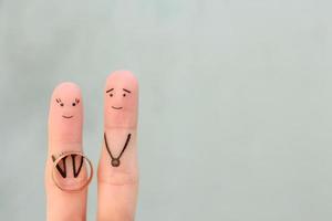 Fingers art of happy couple. Concept of woman proposing to man. photo