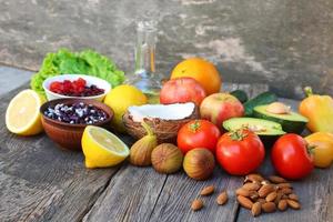 Healthy food of vegetable origin on old wooden background. Concept of proper nutrition. photo