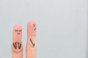 Fingers art of couple. Concept woman made an offer to get married, man refused. photo