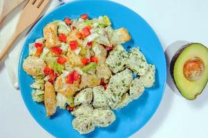 Fried potatoes with bacon and green onion on wooden background, top view. photo