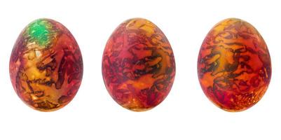 Collection of abstract orange - brown - green drawings on painted eggs. Easter concept, fantasy animal eggs. Copy space photo