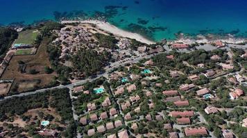 Aerial view of villas with pools and sea with beach video