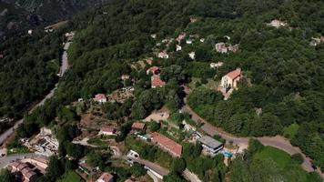 Aerial orbiting view of village Bocognano and church video