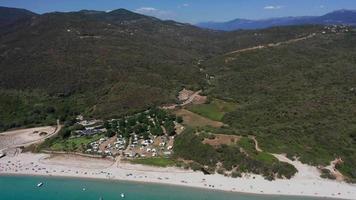 Aerial backward view of beach and sea coast with hills video