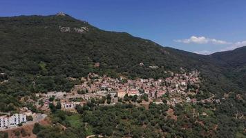 Aerial orbiting view of city Olmeto in mountains video