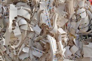 Stack of cardboard carton packed pile prepare for recycling on plant. Eco-friendly lifestyle zero waste concept. Environmental conversation technology. Garbage sorting. Ecology reuse green world idea. photo