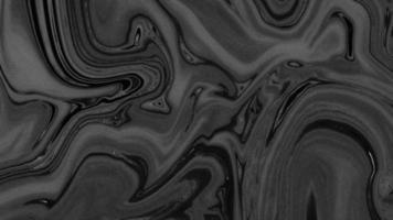 Abstract flowing liquid curve line in grey silver black metallic. Glossy pattern cool background textures. Beautiful drawing with the divorces and wavy lines in gray tones. Beautiful Marbling. photo