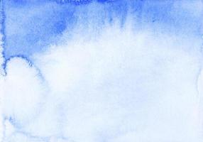 Watercolor blue ombre background texture. Watercolour deep blue gradient. Stains on paper. photo