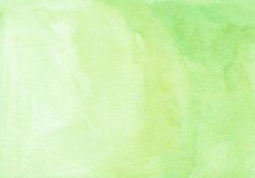 Watercolor light yellow green color background texture. Watercolour lime gradient hand painted. Stains on paper. photo