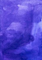 Watercolor deep blue background texture hand painted. Watercolour royal purple color stains on paper. photo