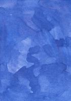 Watercolor calm azure blue background painting. Brush strokes on paper photo