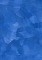 Watercolor deep blue background texture hand painted. Aquarelle azure blue abstract backdrop. Stains on paper photo