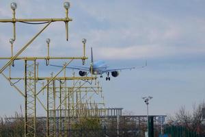 commercial airplane entrance to an airport, airport entrance signs, airport entrance lights photo