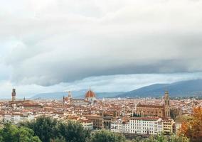 Top view of italian old town with huge cathedral in the middle and river in cloudy afternoon photo