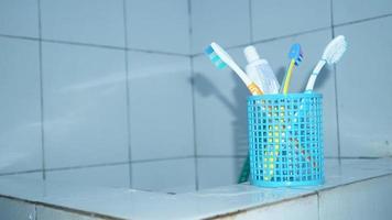 family toothbrush over the tub photo