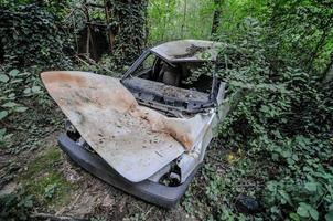 Car in Abandoned Industrial Gravel Quarry and Sand Stone Refinery photo