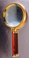 Golden magnifying glass photo